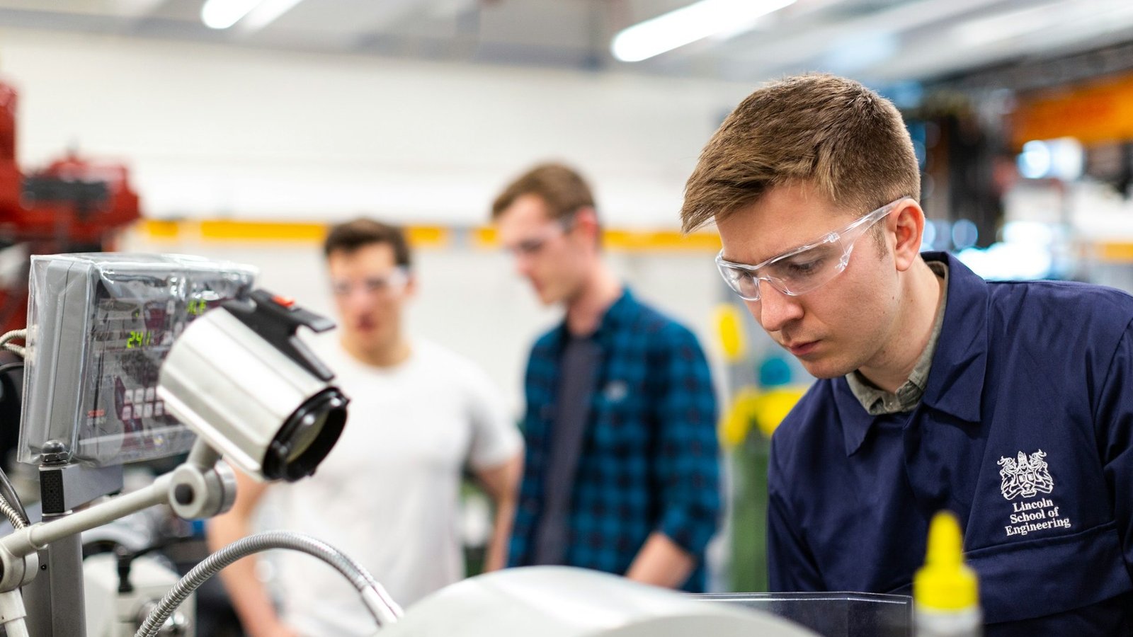 Engineering professionals collaborating on digital product development and PLM solutions